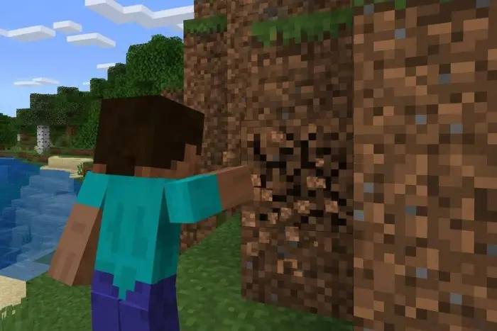 Character breaking dirt block by a river