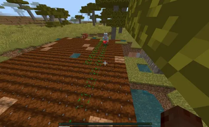 Robot tending crops on a tilled farm plot